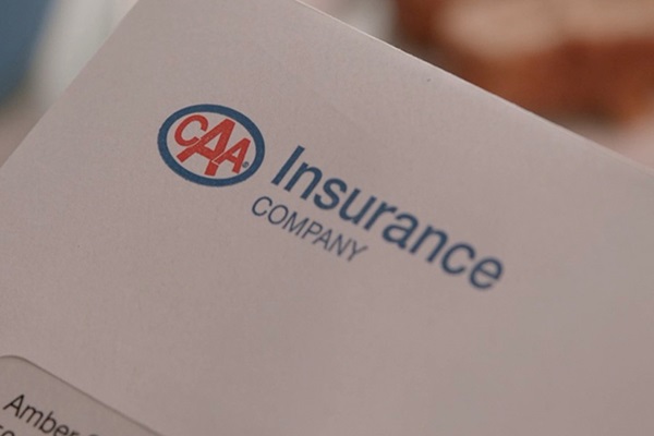An envelope with the CAA Insurance Company logo in the top left corner