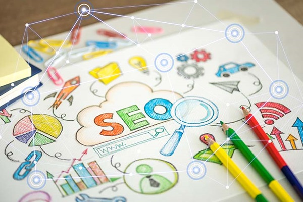 A colourful illustration of various digital-related icons with "SEO" drawn in the middle.